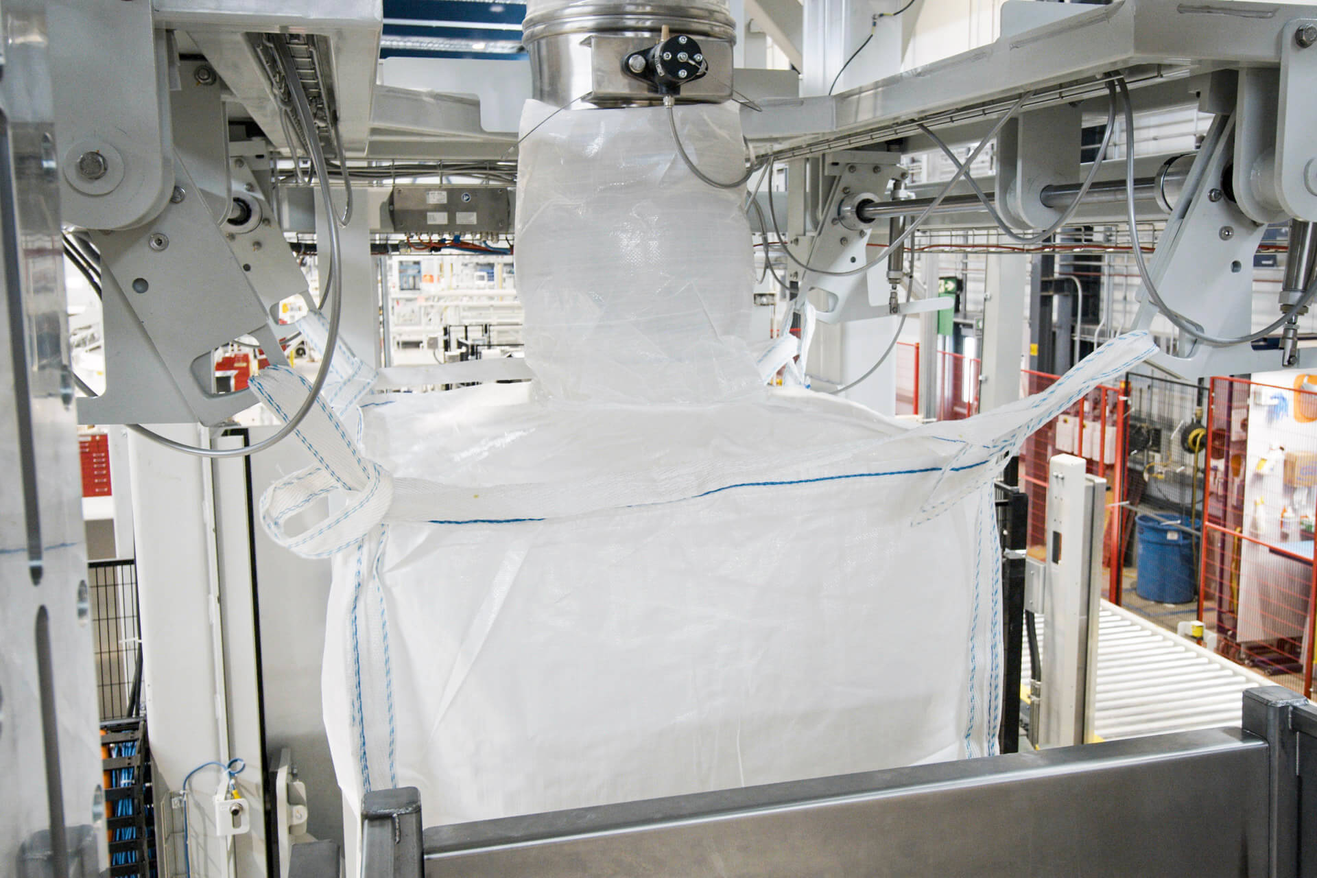 View of a spout filling a big bag with bulk materials